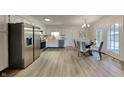 Eat-in kitchen with stainless steel appliances and light flooring at 104 Rush Ct, Fishers, IN 46038
