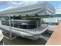 View of a Bennington pontoon boat docked on the water at 14565 Geist Ridge Dr, Fishers, IN 46040