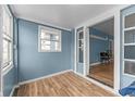 Bright sunroom with wood floors and view to dining area at 2814 Brookside Ave, Indianapolis, IN 46218