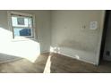 Small bedroom with damaged walls and flooring at 2925 Stuart St, Indianapolis, IN 46218