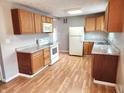 Functional kitchen featuring wooden cabinets, modern appliances, and durable countertops, with a convenient layout at 3513 N Layman Ave, Indianapolis, IN 46218