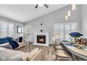 Spacious living room with fireplace, and dining area at 4549 Pepper Ct, Indianapolis, IN 46237