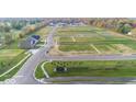Enjoy this aerial view of the community featuring vacant lots with green space in a desirable neighborhood setting at 4976 Elaine Ct, Noblesville, IN 46062