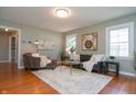 Cozy living room with hardwood floors, comfy seating, and tasteful decor at 6118 Evanston Ave, Indianapolis, IN 46220
