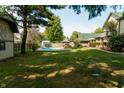 Expansive backyard featuring a pool and shed at 877 Revere Ct, Greenwood, IN 46142