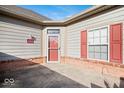 House exterior showing front entrance with red door and red shutters at 1088 Laurelwood Ln, Greenwood, IN 46142