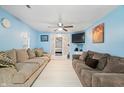 Bright living room with light blue walls and comfy sofas at 1743 Sparrow Ave, Indianapolis, IN 46227