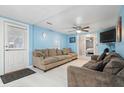 Bright living room with light blue walls and comfy sofas at 1743 Sparrow Ave, Indianapolis, IN 46227
