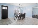 Dining room features a dark wood table with six chairs and light blue walls at 1749 Sparrow Ave, Indianapolis, IN 46227