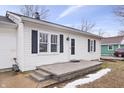 Front view of a white house with a concrete porch and small yard at 1749 Sparrow Ave, Indianapolis, IN 46227