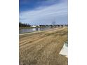 Community pond with walking trail and exercise equipment at 19438 Astoria Ave, Sheridan, IN 46069