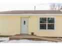Rear exterior view of home with new door and window at 195 E Center Dr, Mooresville, IN 46158