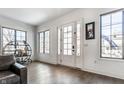 Bright entryway with hardwood floors, white door and large windows at 2301 Nowland Ave, Indianapolis, IN 46201