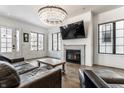 Open living space with hardwood floors, fireplace, and comfortable seating at 2301 Nowland Ave, Indianapolis, IN 46201