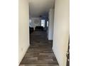 Bright entryway with wood-look tile floors and a view of the living room at 2746 Lanai Ln, Greenwood, IN 46143