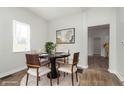 Cozy dining room featuring a round table, modern chairs, and a contemporary rug at 3102 N Arsenal Ave, Indianapolis, IN 46218