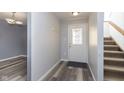 Inviting foyer with sleek floors, fresh paint, and a staircase at 5183 Fairway Dr, Avon, IN 46123