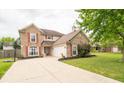 Two-story brick house with attached garage and large yard at 57 Sebring Ct, Whiteland, IN 46184
