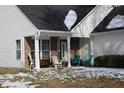 Cozy front porch with rocking chairs and welcome sign at 6420 Birds Eye Dr, Indianapolis, IN 46203
