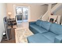 Living room with sectional sofa, TV, and access to a deck at 6639 N College Ave, Indianapolis, IN 46220