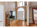 Bright and spacious entryway with hardwood floors and high ceilings at 9711 Sunwood Way, Carmel, IN 46032