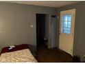 Small bedroom with a bed and access to other rooms at 1456 Hoyt Ave, Indianapolis, IN 46203