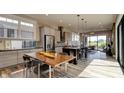 Modern kitchen featuring island, stainless steel appliances, and hardwood floors at 15994 Meadow Frost Ct, Fishers, IN 46037