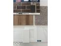 Image of home design material samples, including brick, flooring, and cabinetry at 15994 Meadow Frost Ct, Fishers, IN 46037