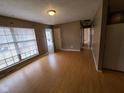 Spacious living room with hardwood floors and access to other rooms at 1908 Edgemont Way, Anderson, IN 46011