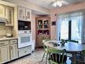Eat-in kitchen with updated cabinets and corner hutch at 5299 Carnoustie Cir, Avon, IN 46123