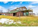 Rustic barn with green roof, wooden siding, elevated deck, and large stalls at 7615 Fayette Rd, Lebanon, IN 46052