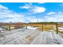 Wooden deck overlooking a pond and expansive farmland at 7615 Fayette Rd, Lebanon, IN 46052