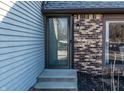 Close-up of the front entrance showing the brick and siding on the side of the building at 788 Monte Vista Ct, Greenwood, IN 46143