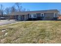 Ranch-style home with a landscaped yard at 9790 Nw Union Rd, Mooresville, IN 46158
