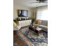 Bright living room with hardwood floors and comfy seating at 9790 Nw Union Rd, Mooresville, IN 46158