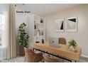 Bright home office with built-in shelving, large desk, and two chairs at 10349 Gateway Dr, Brownsburg, IN 46234