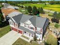 Aerial view of a two-story house with a gray roof at 10723 Pokagon Way, Indianapolis, IN 46239