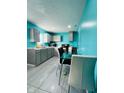 Modern kitchen with gray cabinets and teal walls at 1243 W 19Th St, Indianapolis, IN 46202