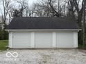 A detached three-car garage provides ample parking and storage space at 2029 W 60Th St, Indianapolis, IN 46228