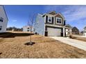 Well-maintained two-story home with blue siding and a spacious front yard at 2322 Dixon Creek Dr, Whitestown, IN 46075