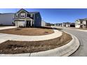 A quiet street view showcases a neighborhood with well-kept lawns and sidewalks at 2322 Dixon Creek Dr, Whitestown, IN 46075