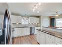 Bright kitchen featuring white cabinets, granite countertops, stainless steel appliances and a breakfast bar at 2379 Liatris Dr, Plainfield, IN 46168