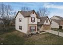 Attractive home with brick accents, red shutters, and mature trees in a well-kept neighborhood at 3656 Homestead E Cir, Plainfield, IN 46168