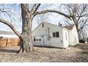 A view of the back exterior with a white door and window at 4034 N Temple Ave, Indianapolis, IN 46205