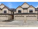 Charming townhome featuring a well-manicured lawn and a two-car garage for convenient parking and storage at 4205 Douro Trl, Westfield, IN 46062