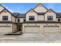 Charming townhome featuring a well-manicured lawn and a two-car garage for convenient parking and storage at 4205 Douro Trl, Westfield, IN 46062