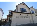Charming home featuring light siding, dark trim, and a convenient two-car garage at 4229 Douro Trl, Westfield, IN 46062