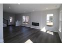 Spacious living room with modern floors, recessed lights, and cozy fireplace at 4229 Douro Trl, Westfield, IN 46062