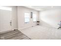 Spacious living room with neutral carpeting and large windows at 453 Gathering Ln, Greenwood, IN 46143