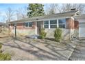 Brick ranch home with attached garage and paver patio at 4575 Ayrshire St, Indianapolis, IN 46228